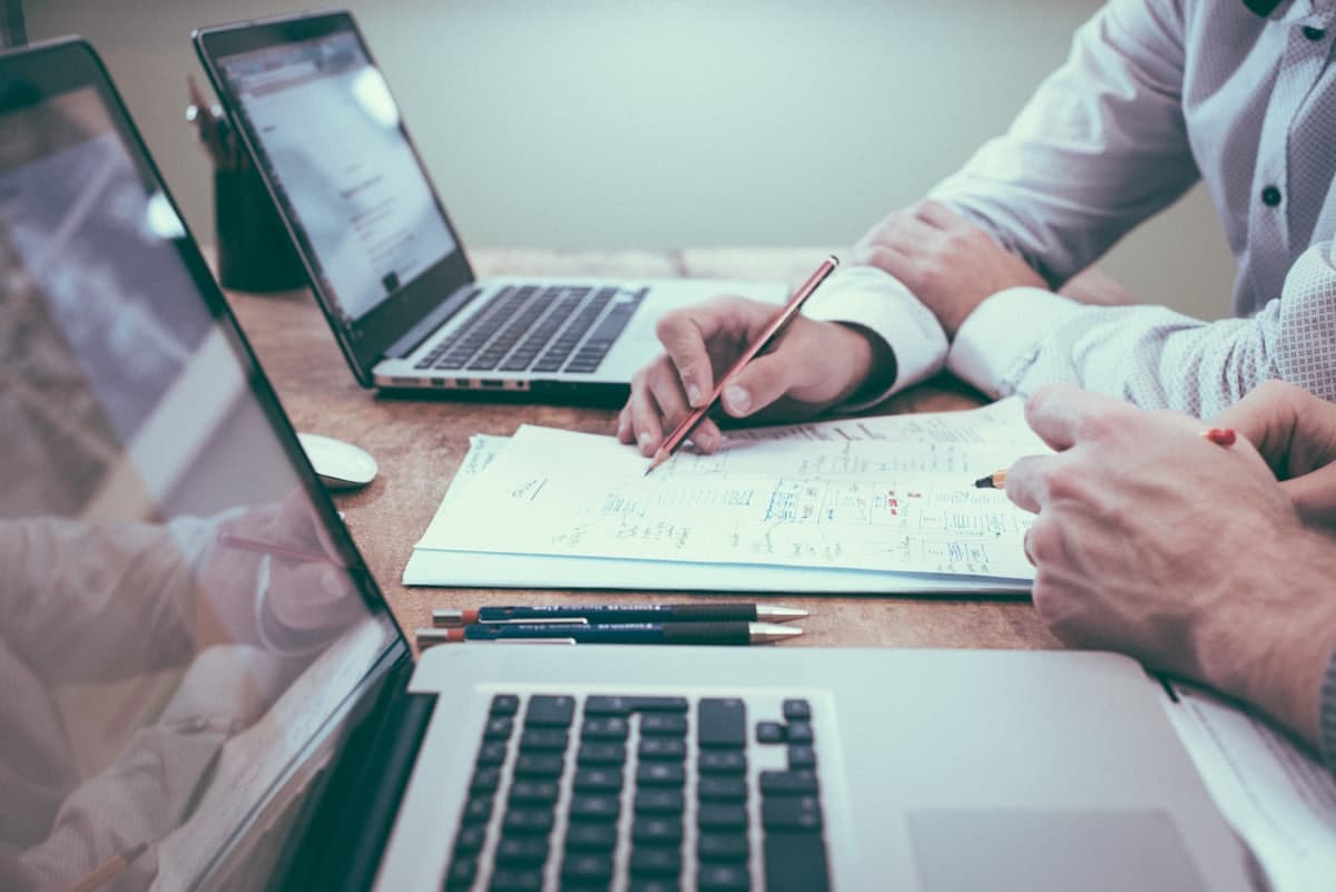 Two accountants reviewing financial records together at a desk